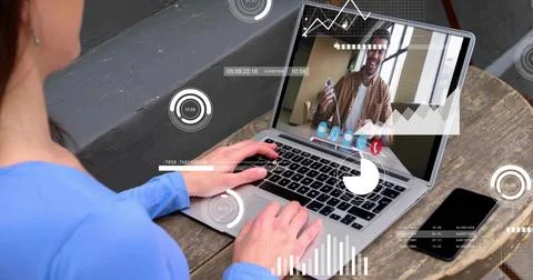 Typing user in blue top at home office, viewing man holding credit card, bag and Stock Photos