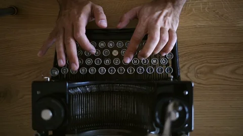 Typing on the vintage typewriter Stock Footage 97818327