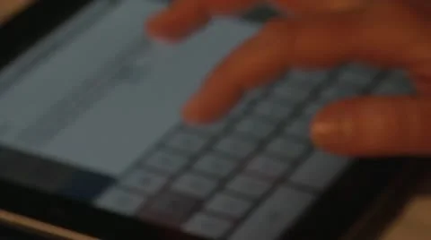 Typing on Virtual Touchscreen Keyboard. Digital tablet. Defocused. Stock Footage 10747930