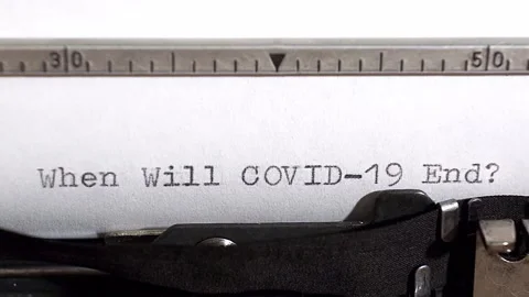 Typing When Will Covid-19 End in black ink on an old vintage typewriter. Stock Footage 131472444