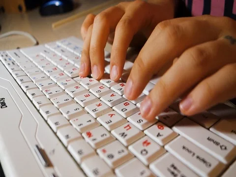 Typing on white keyboard Stock Footage