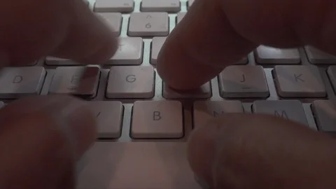 Typing on a white keyboard￼ on gray table￼￼. Stock Footage 119265585