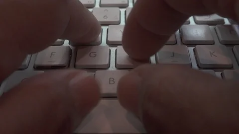 Typing on a white keyboard￼ on gray table￼￼. Vidéo 119270766