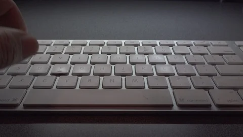 Typing on a white keyboard￼ on gray table￼￼. Stock Footage 119278870