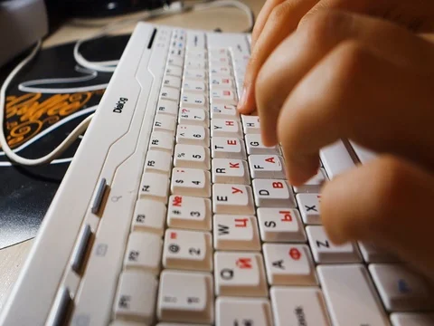 Typing on white keyboard (left) Video stock 115726169