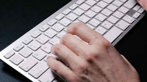 Typing on the wireless keyboard with mouse Stock Footage 57465973