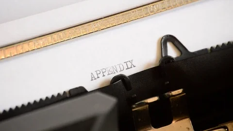 Typing the word Appendix with an old manual typewriter Stock Footage 72658384