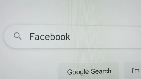 Typing  the word "Facebook" into the google search, 2k Stock Footage 123240833