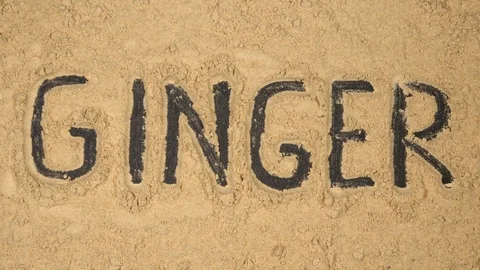 Typing Word "ginger" on a ginger powder background - Stop motion Stock Footage 90442344