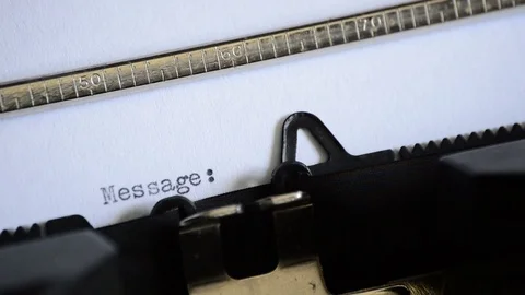 Typing the word Message: with an old manual typewriter Stock Footage 72690359