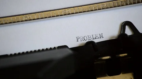 Typing the word PROBLEM with an old manual typewriter Stock Footage 73241950