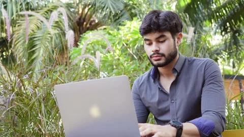 Typing young bearded man with low angle view Stock Footage 204843737