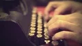 Typist pressing buttons on vintage typewriter machine, retro video archives HD Footage