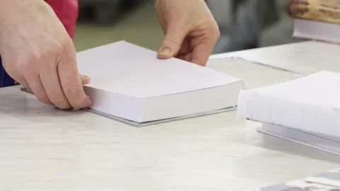 Typographic assembly of a hardcover book Stock Footage 300193777