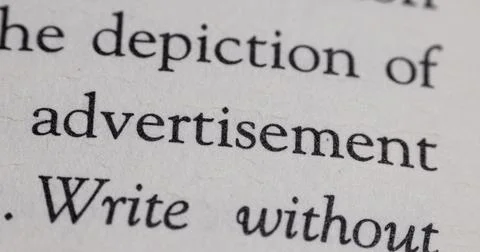 Typography printing words text font in book on white paper textured surface.. Stock Photos