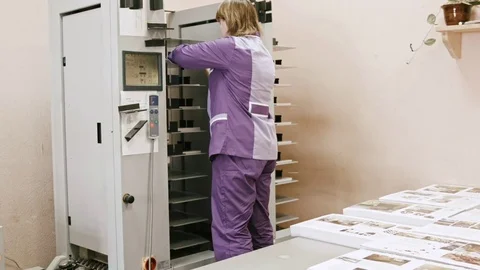Typography - woman worker working on folder machine in printing house - Stock Footage 74203426