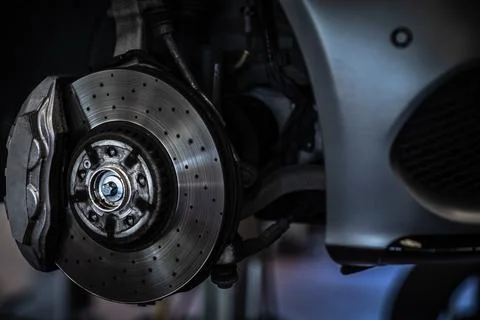 Tyre change - wheel balancing or repair and change car tire at auto service 写真素材
