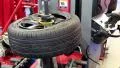 Tyre fitting shop. Worker remove the tire HD Footage