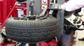 Tyre fitting. Worker remove the tire HD Footage