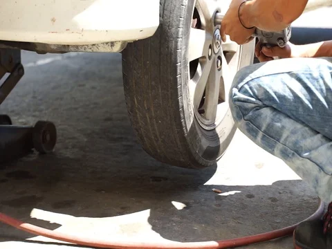 Tyre shop workers Stock Footage 105023609