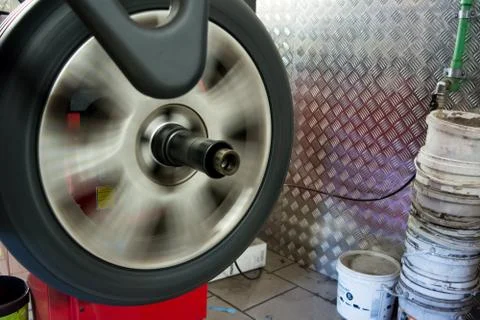 Tyre spinning on the balancing machine Stock Photos