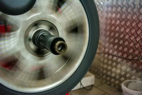 Tyre spinning on the balancing machine Stock Photos