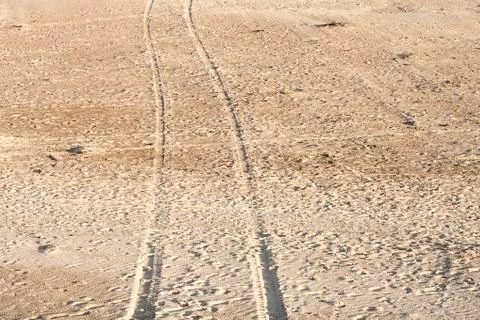 Tyre tracks on the sand Stock Photos
