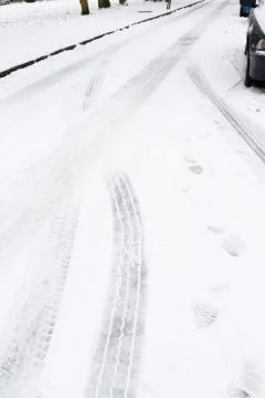 Tyre tracks in snow Stock Photos