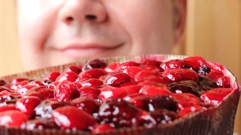 Tyrolean berry pie and face of happy baker close-up Video stock 106351781