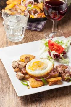 Tyrolean groestl with an egg Stock Photos