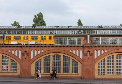 An U-bahn metro train passing on a viaduct in Berlin, Germany. Stock Photos