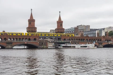 U-Bahn train passing over the Oberbaum Bridge in Berlin, Germany. Stock Photos