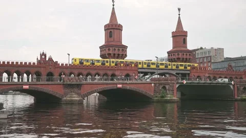 U-Bahn yellow metro train on Oberbaumbruecke Oberbaum Bridge double-deck bridge Stock Footage 163778568