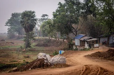U Shaped dirt road of a rural village. Summer Landscape. Rural India. Banku.. Stock Photos