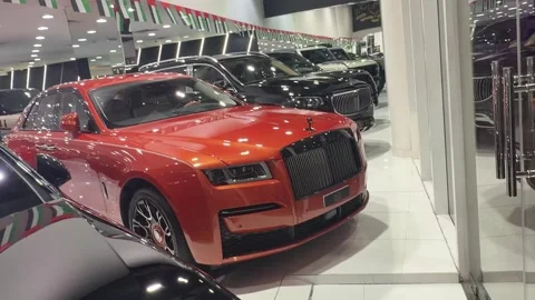 UAE - August 18, 2026 - Luxury supercars inside a showroom Stock Footage 342619391