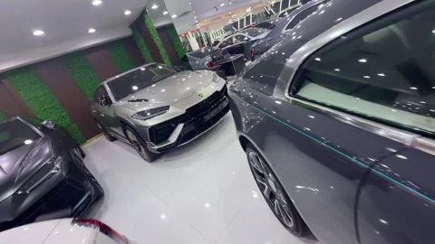 UAE - August 18, 2026 - Luxury supercars inside a showroom Stock Footage 342619447
