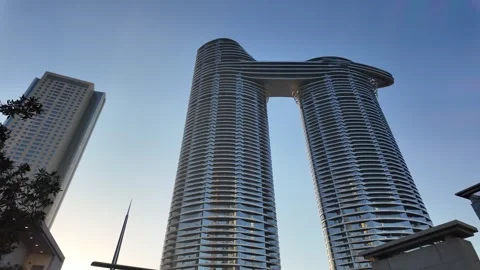 UAE - August 19, 2026 - Burj Park children train, modern architecture, stat.. Stock Footage 342728810