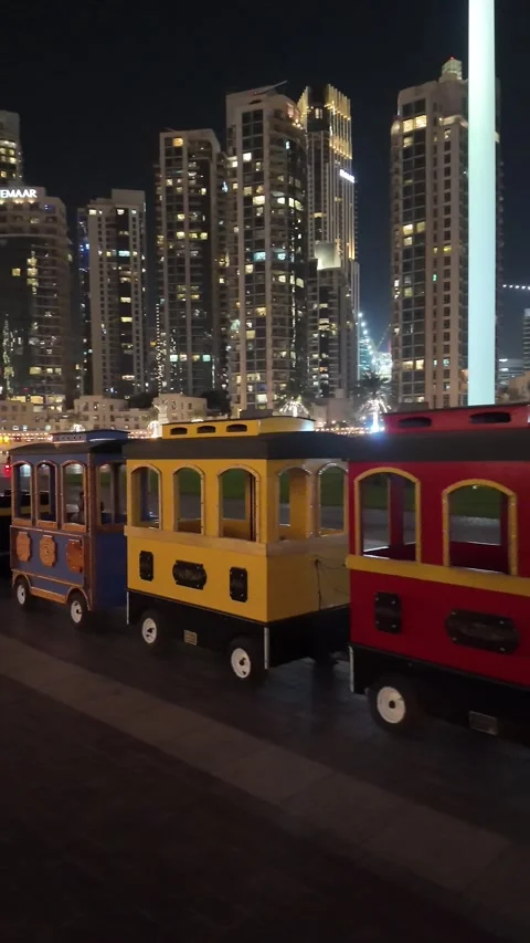 UAE - August 19, 2026 - Burj Park children train, modern architecture, stat.. Video stock 342729009