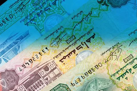 UAE dirham currency notes close up. Money background blue color toned Foto stock