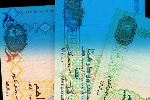 UAE dirham currency notes close up. Money background blue color toned Foto stock