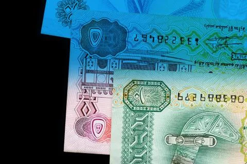 UAE dirham currency notes close up. Money background blue color toned Foto stock