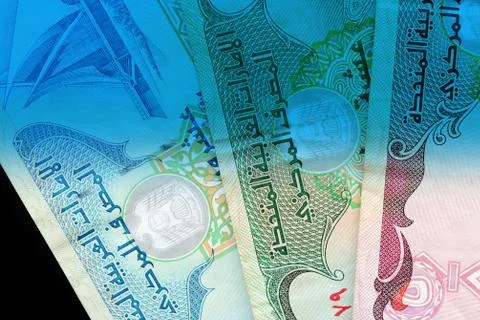 UAE dirham currency notes close up. Money background blue color toned Stock Photos