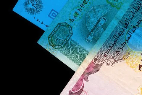 UAE dirham currency notes close up. Money background blue color toned Foto stock