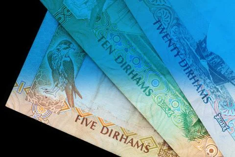 UAE dirham currency notes close up. Money background blue color toned Foto stock
