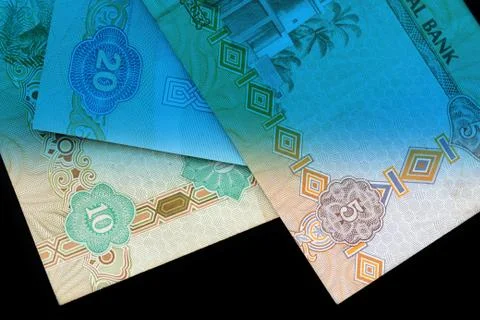 UAE dirham currency notes close up. Money background blue color toned Foto stock