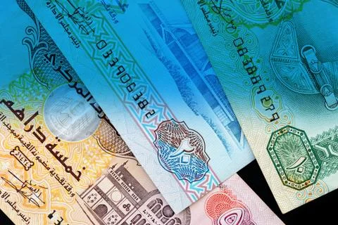 UAE dirham currency notes close up. Money background blue color toned Foto stock