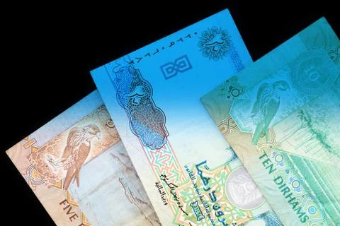 UAE dirham currency notes close up. Money background blue color toned Foto stock