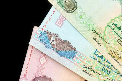 UAE dirham currency notes on a dark background close up Foto stock