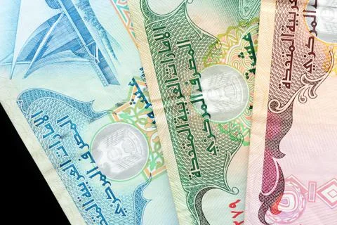 UAE dirham currency notes on a dark background close up Foto stock