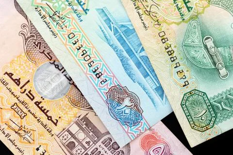 UAE dirham currency notes on a dark background close up Foto stock